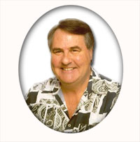 A person smiling at the camera  Description automatically generated